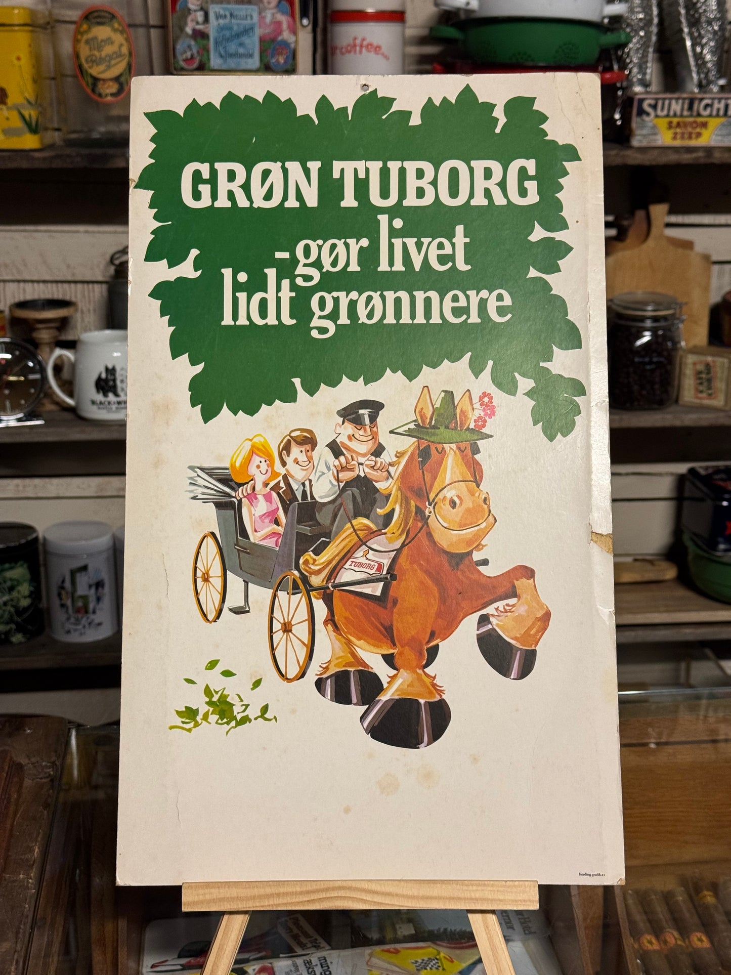 Grøn Tuborg reklameskilt