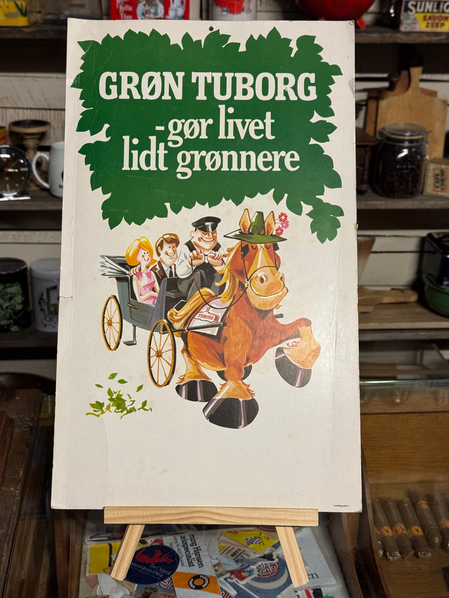 Grøn Tuborg reklameskilt